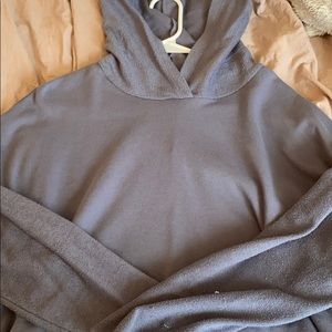 Blue cropped hoodie with “inside out” sleeves